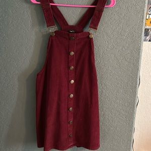 This is an overall dress that you can wear with any color long sleeve.